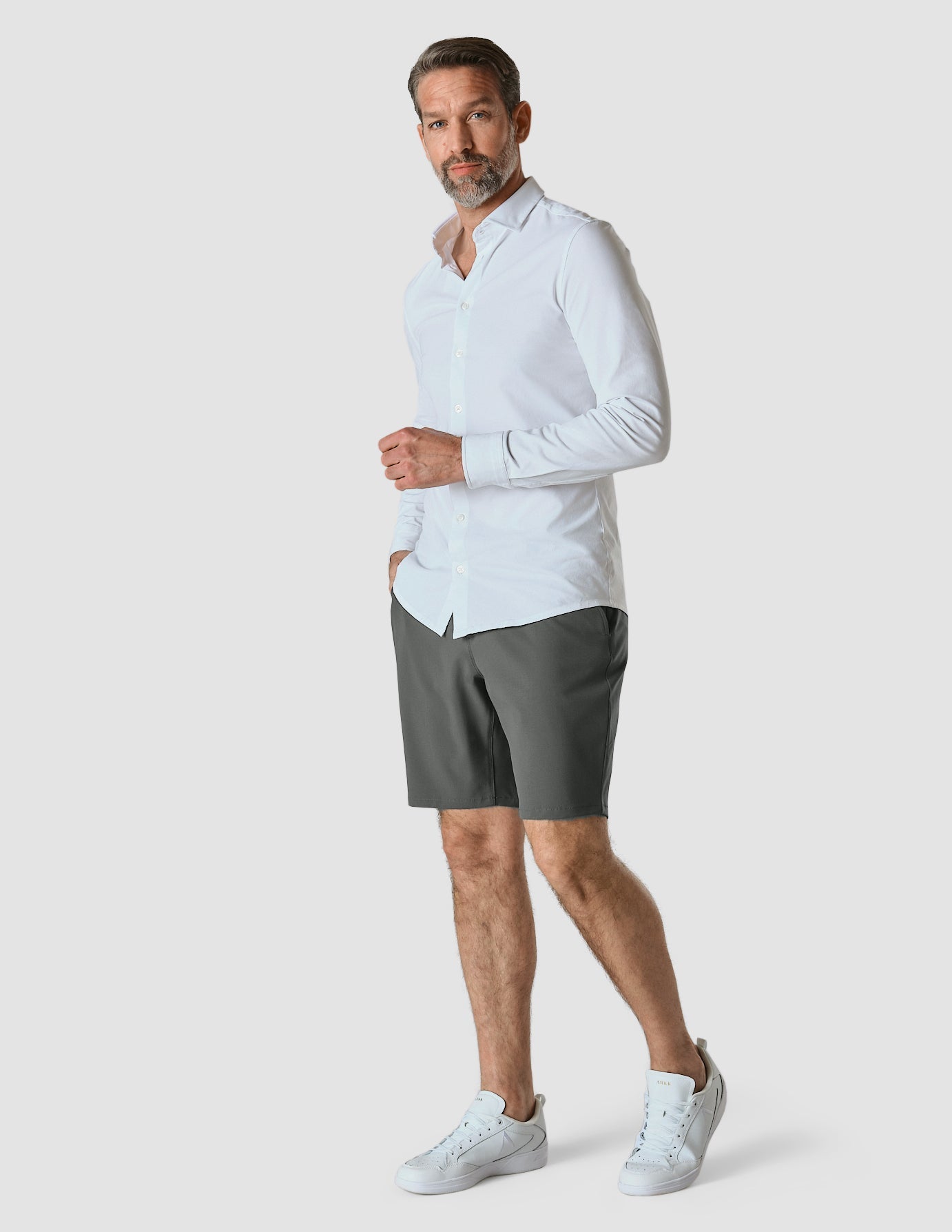 Model in full body wearing Essential Shorts grey